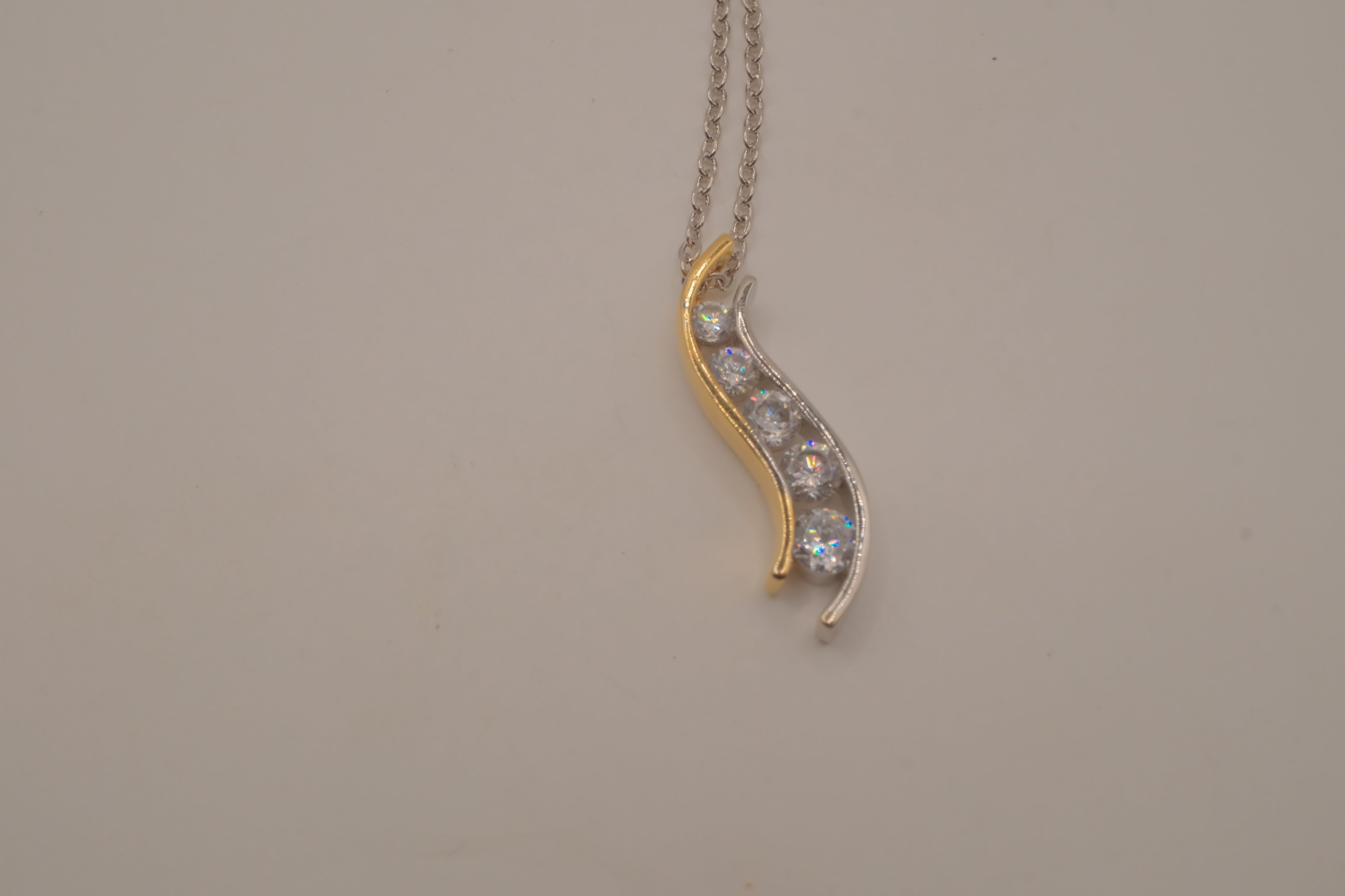 Sterling silver two tone journey-style pendant necklace