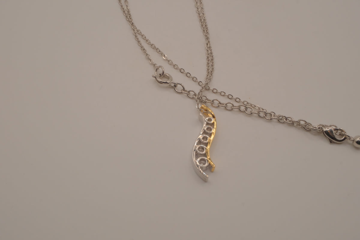 Sterling silver two tone journey-style pendant necklace