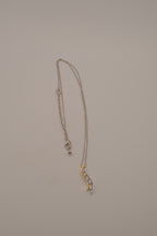 Sterling silver two tone journey-style pendant necklace