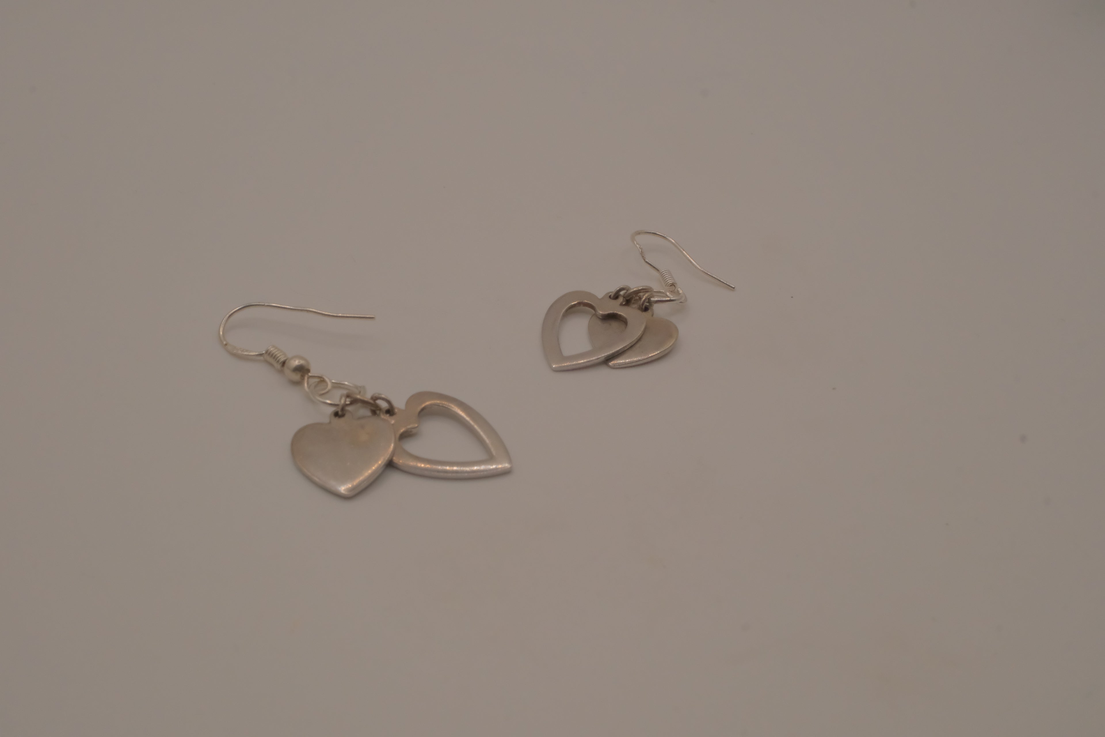 Sterling silver Open and solid double heart dangle earrings