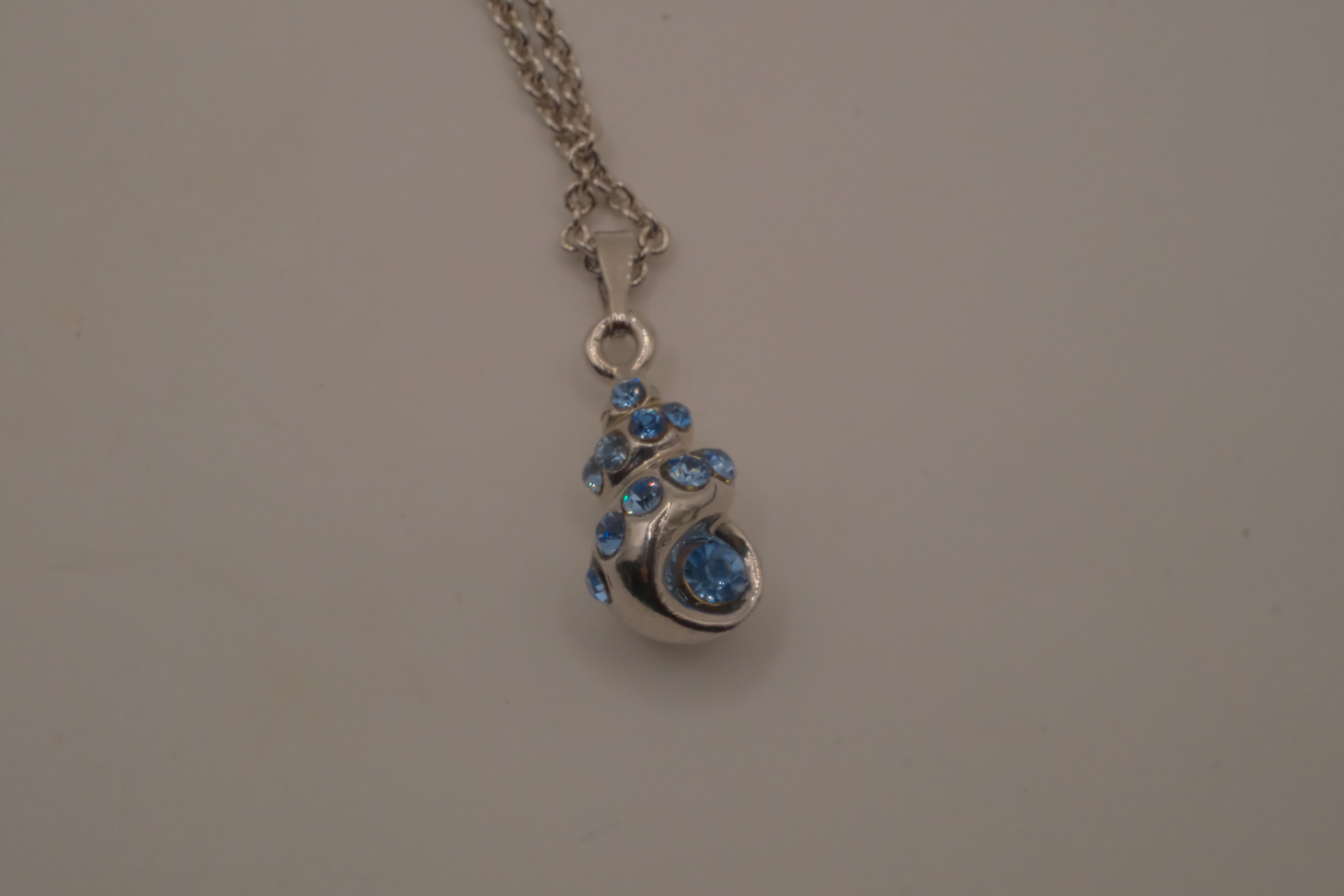 Blue swirling sea shell pendant necklace