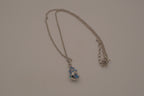 Blue swirling sea shell pendant necklace