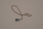 Blue swirling sea shell pendant necklace