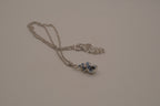 Blue swirling sea shell pendant necklace