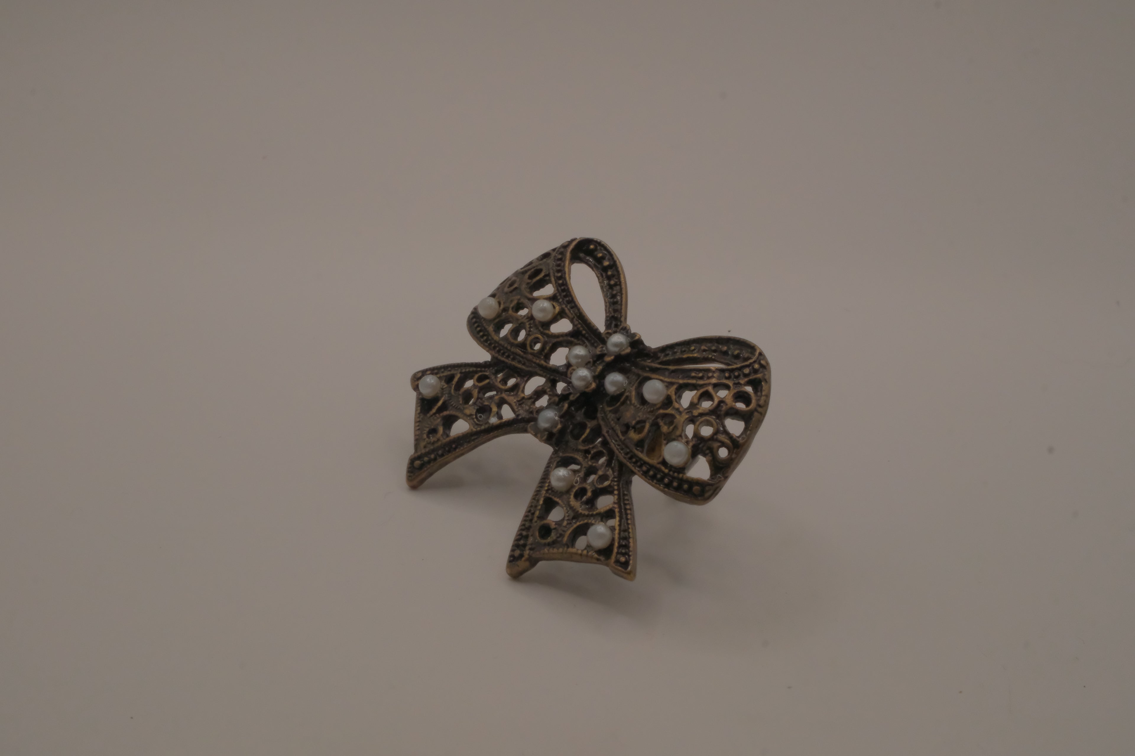 Vintage bronze-tone filigree Statement bow ring