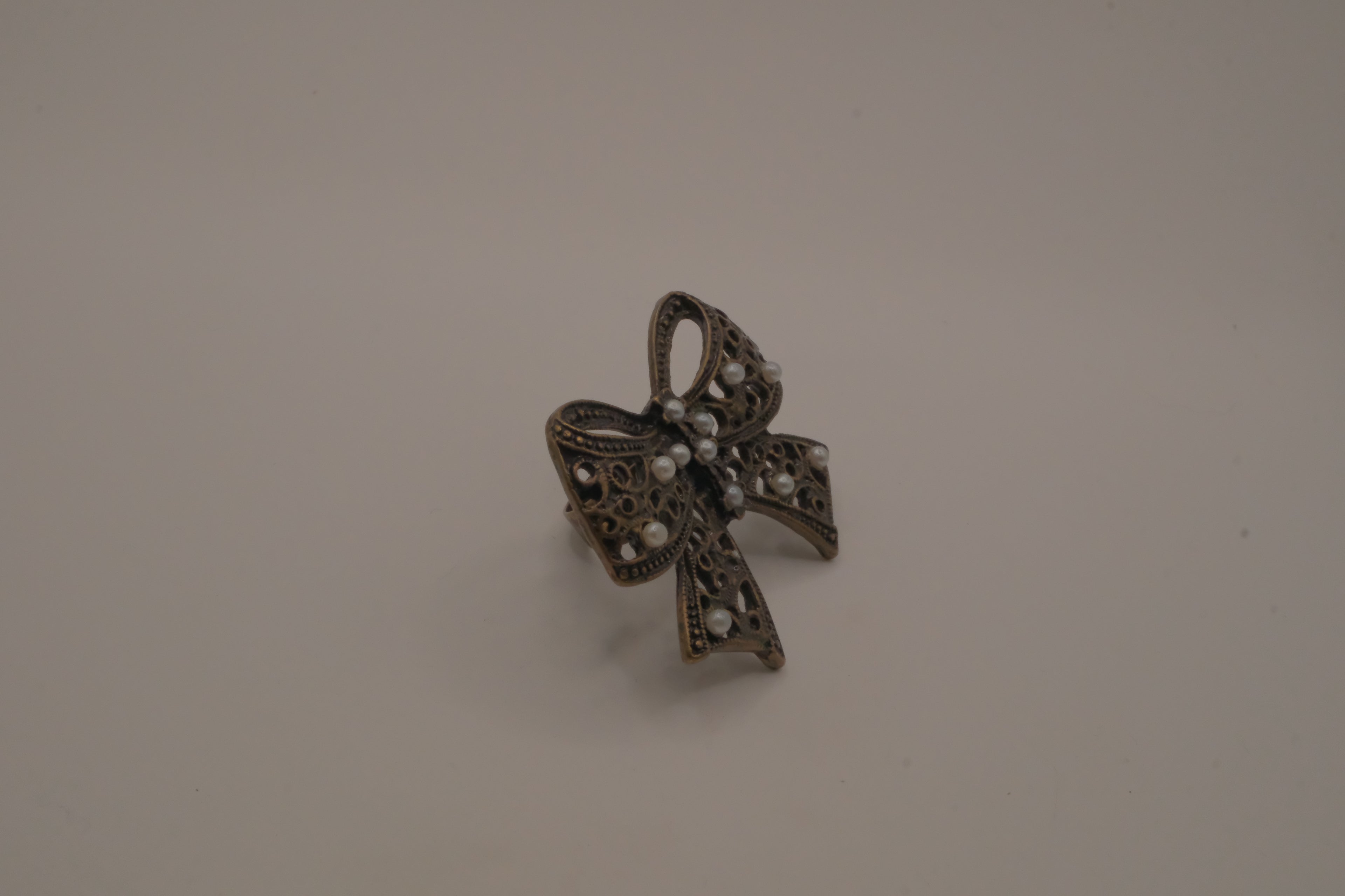 Vintage bronze-tone filigree Statement bow ring