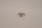 Silver tone halo ring with split-shank band