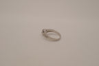 Silver tone halo ring with split-shank band