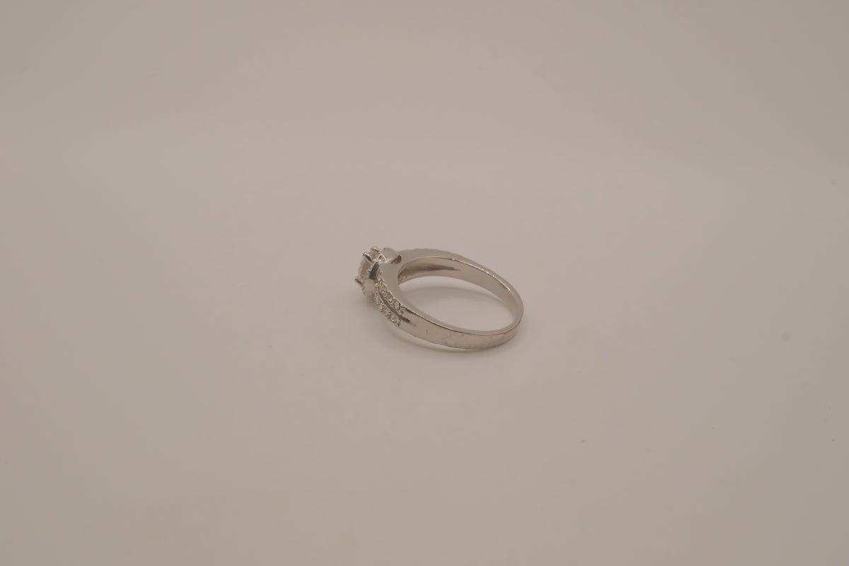 Silver tone halo ring with split-shank band
