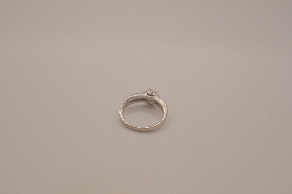 Silver tone halo ring with split-shank band