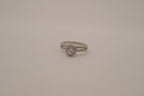Silver tone halo ring with split-shank band