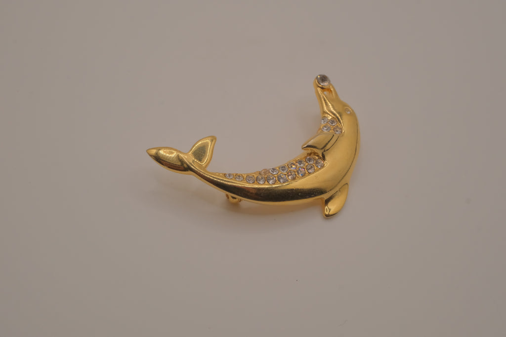 Vintage gold-tone leaping dolphin brooch pin