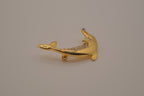 Vintage gold-tone leaping dolphin brooch pin