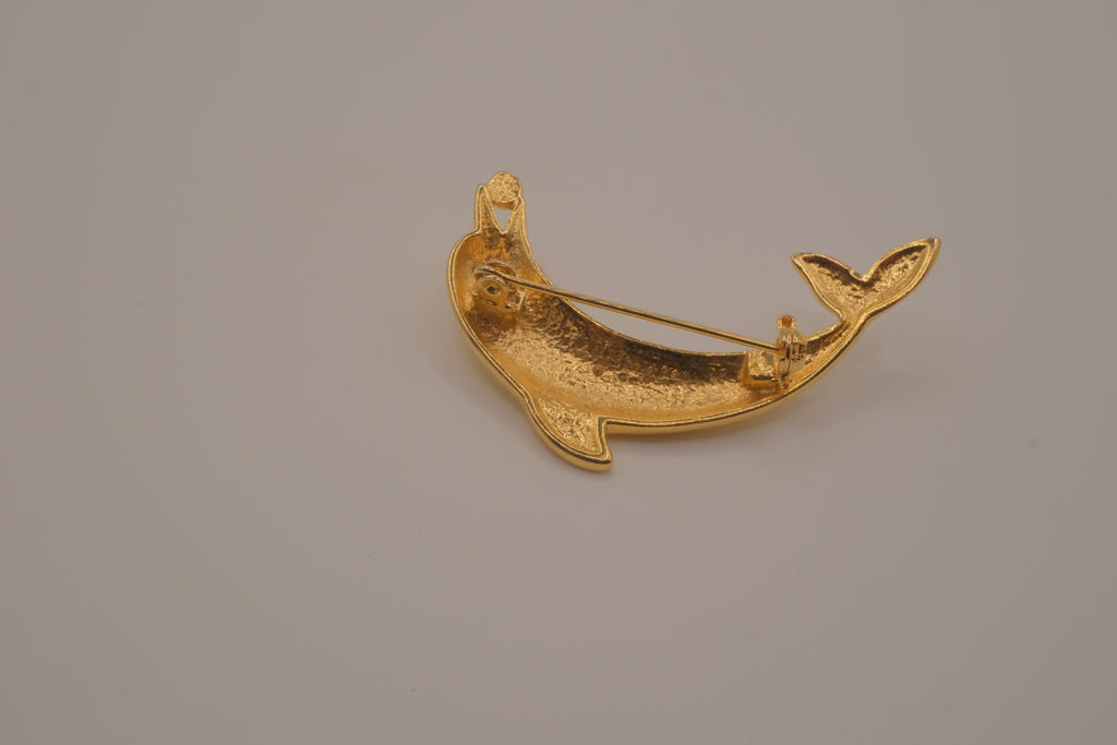 Vintage gold-tone leaping dolphin brooch pin