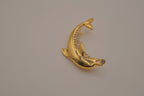 Vintage gold-tone leaping dolphin brooch pin