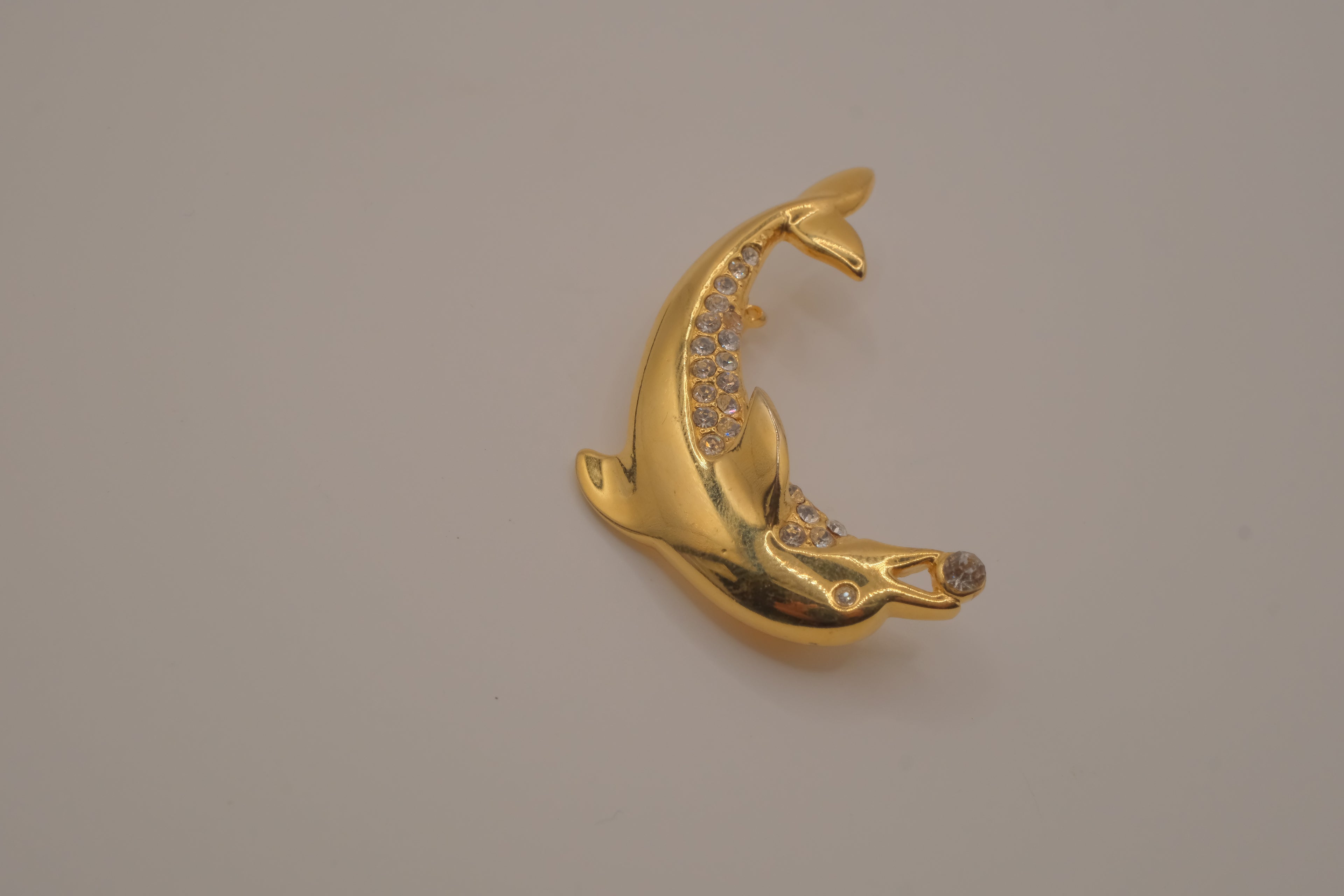 Vintage gold-tone leaping dolphin brooch pin