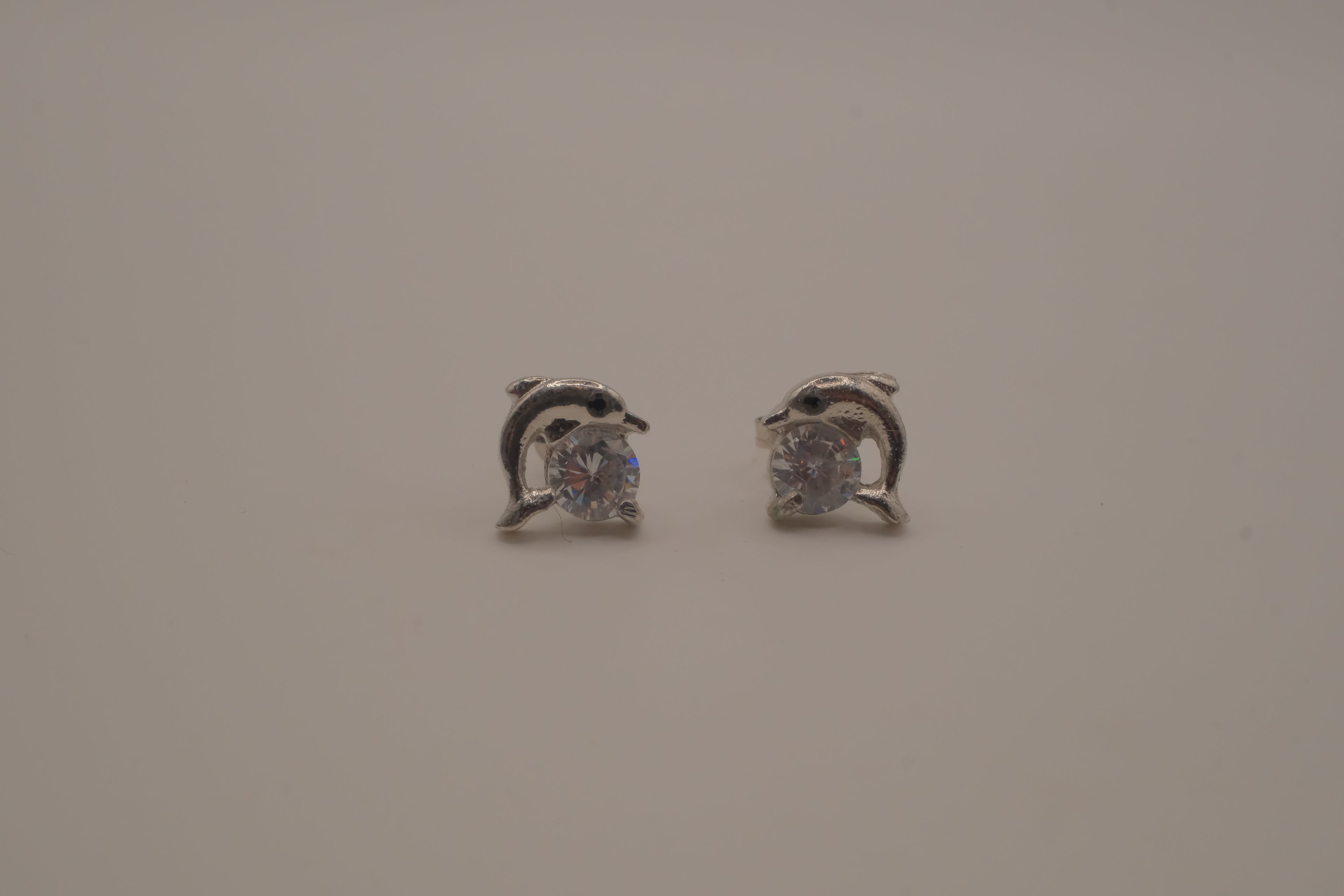 Silver toned dolphin stud earrings&nbsp;