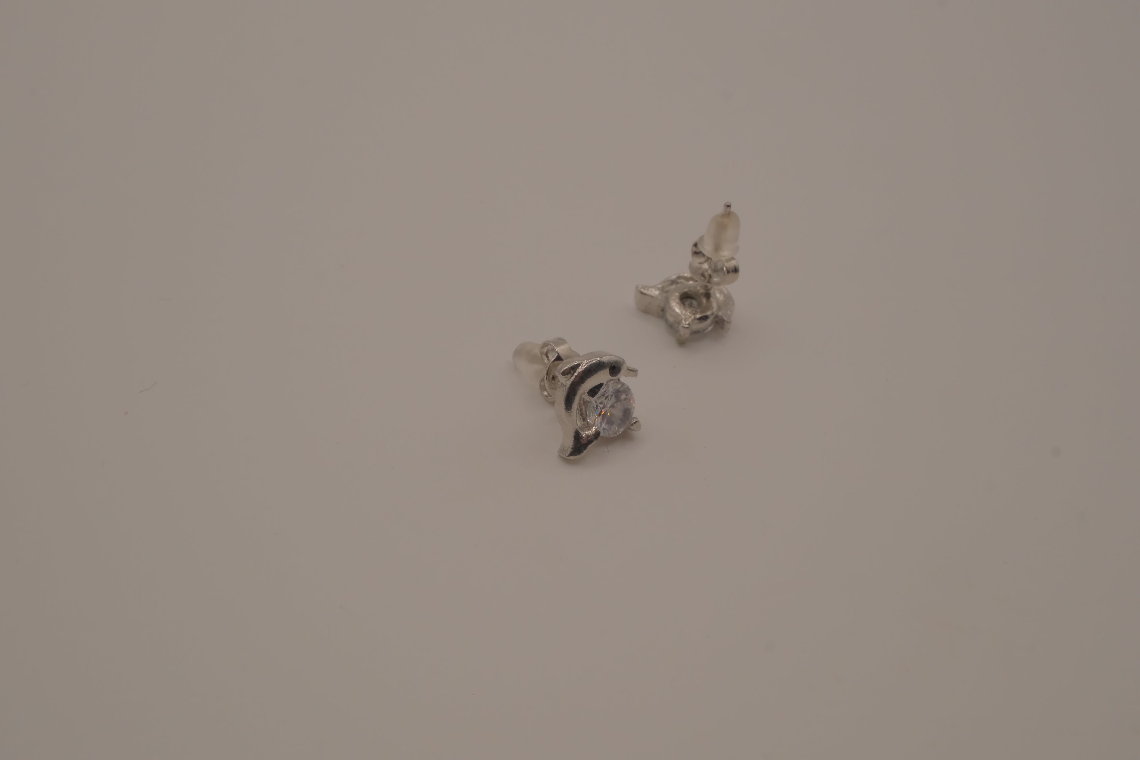 Silver toned dolphin stud earrings&nbsp;