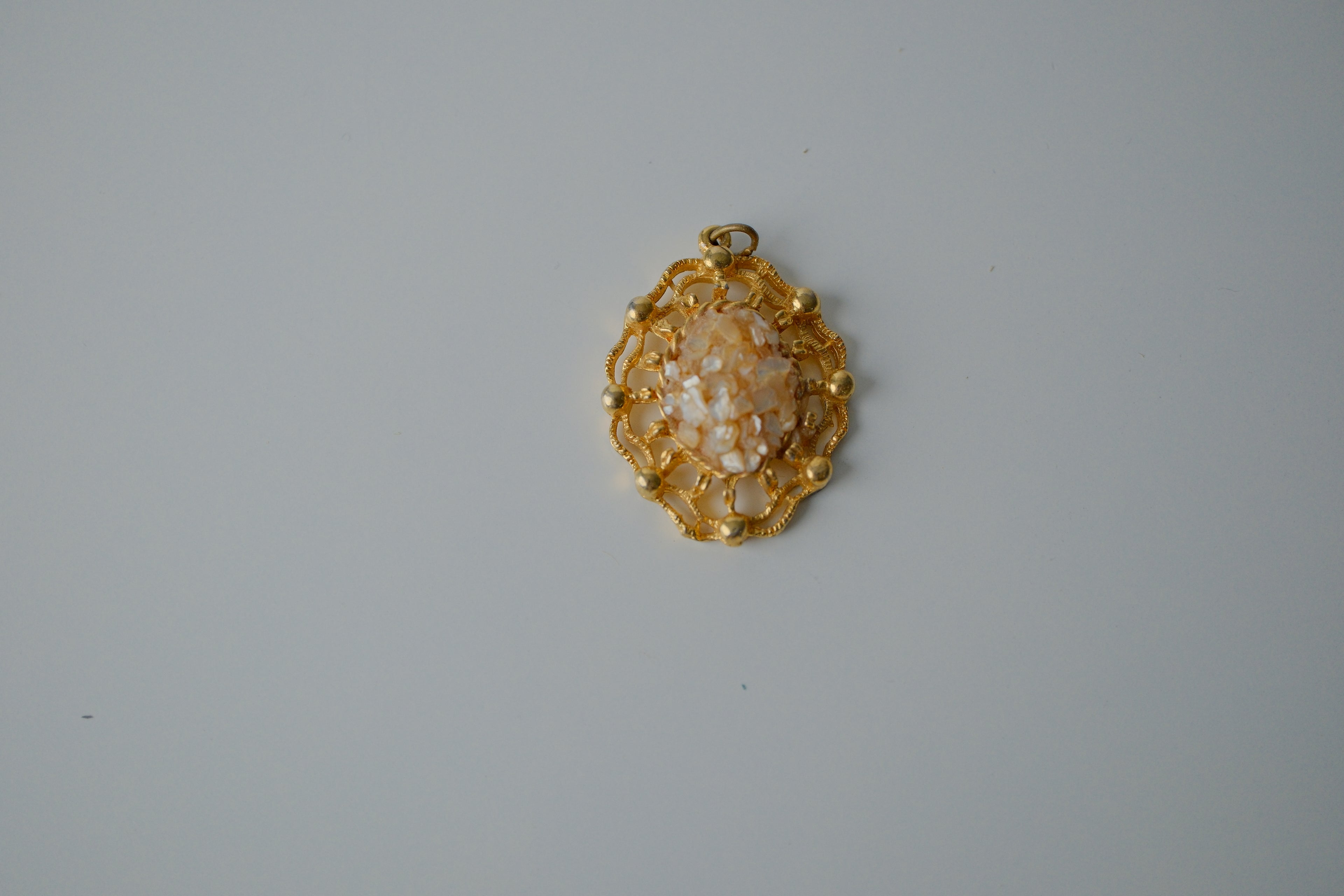 Vintage Gold Toned Filigree pendant with crushed stone