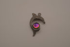 Vintage pewter dolphin pendant with an iridescent glass orb