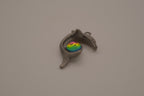 Vintage pewter dolphin pendant with an iridescent glass orb