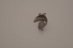 Vintage pewter dolphin pendant with an iridescent glass orb