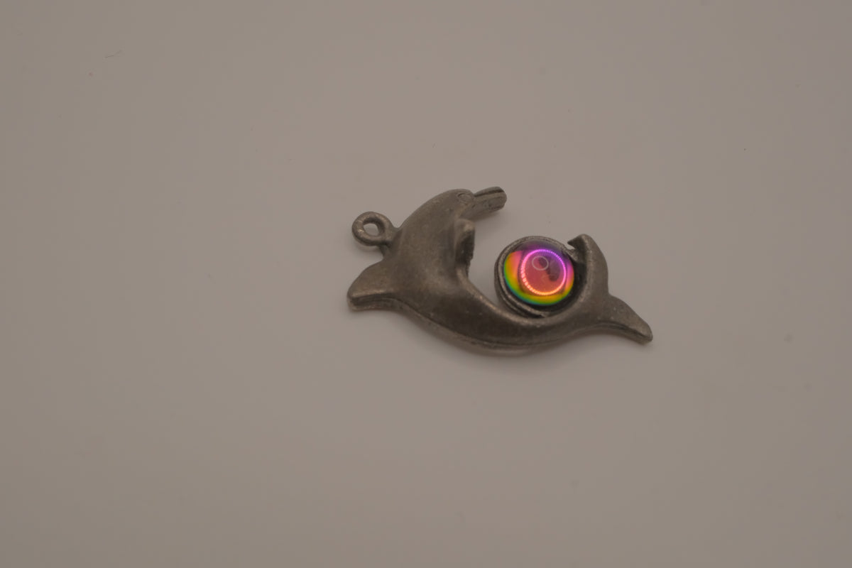 Vintage pewter dolphin pendant with an iridescent glass orb