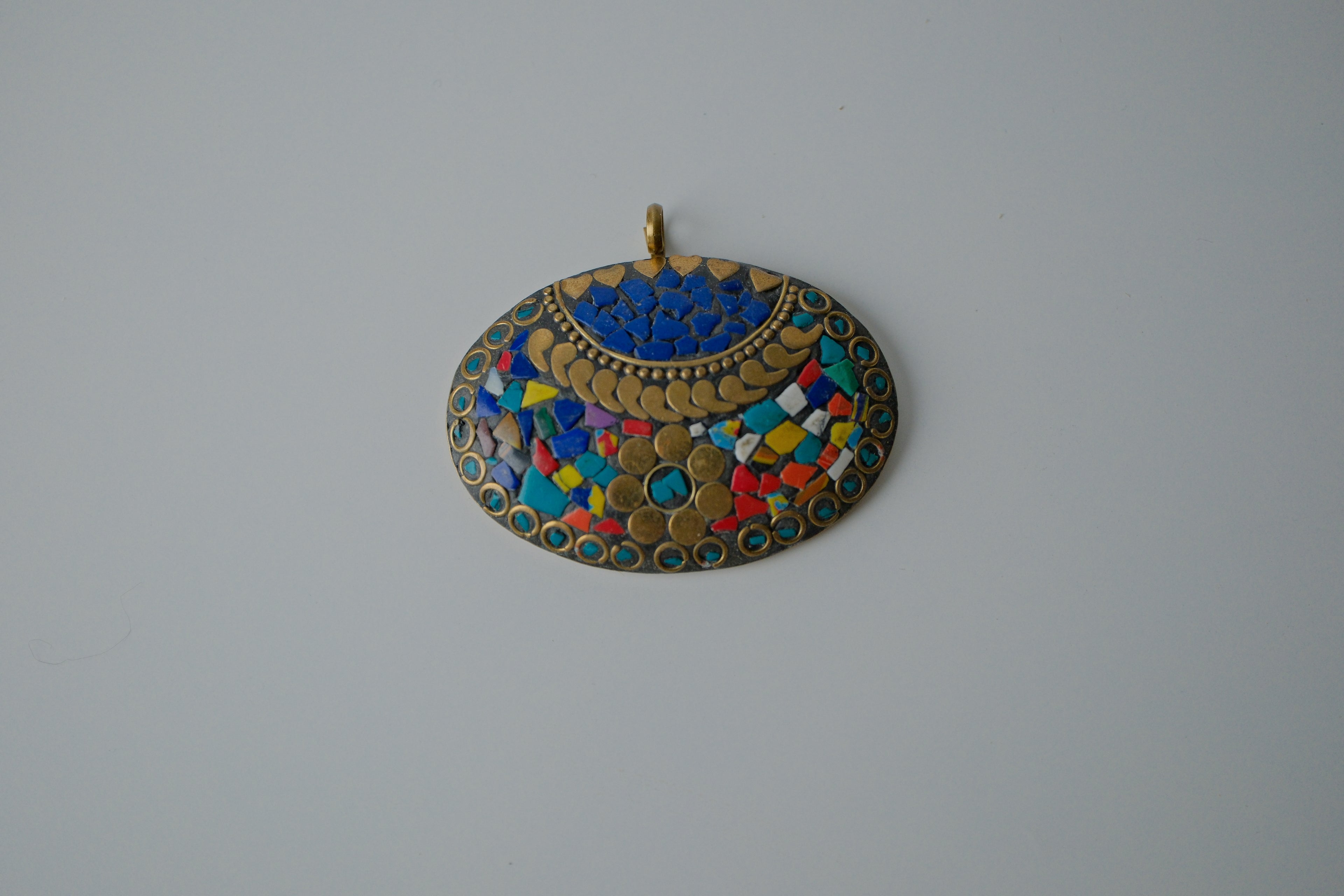 Tibetan pendant with turquoise and coral inlay
