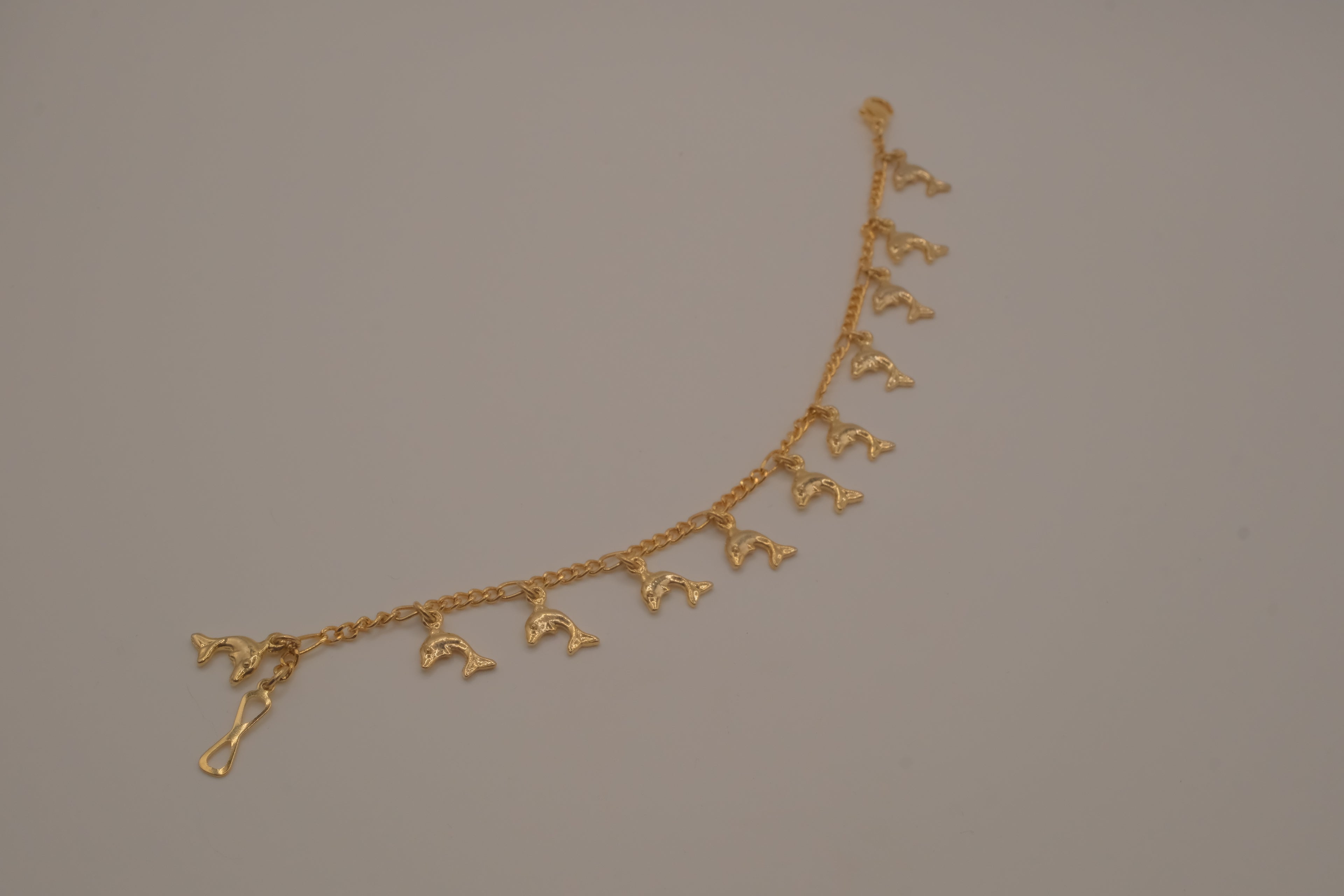 Gold tone Dolphin charm bracelet