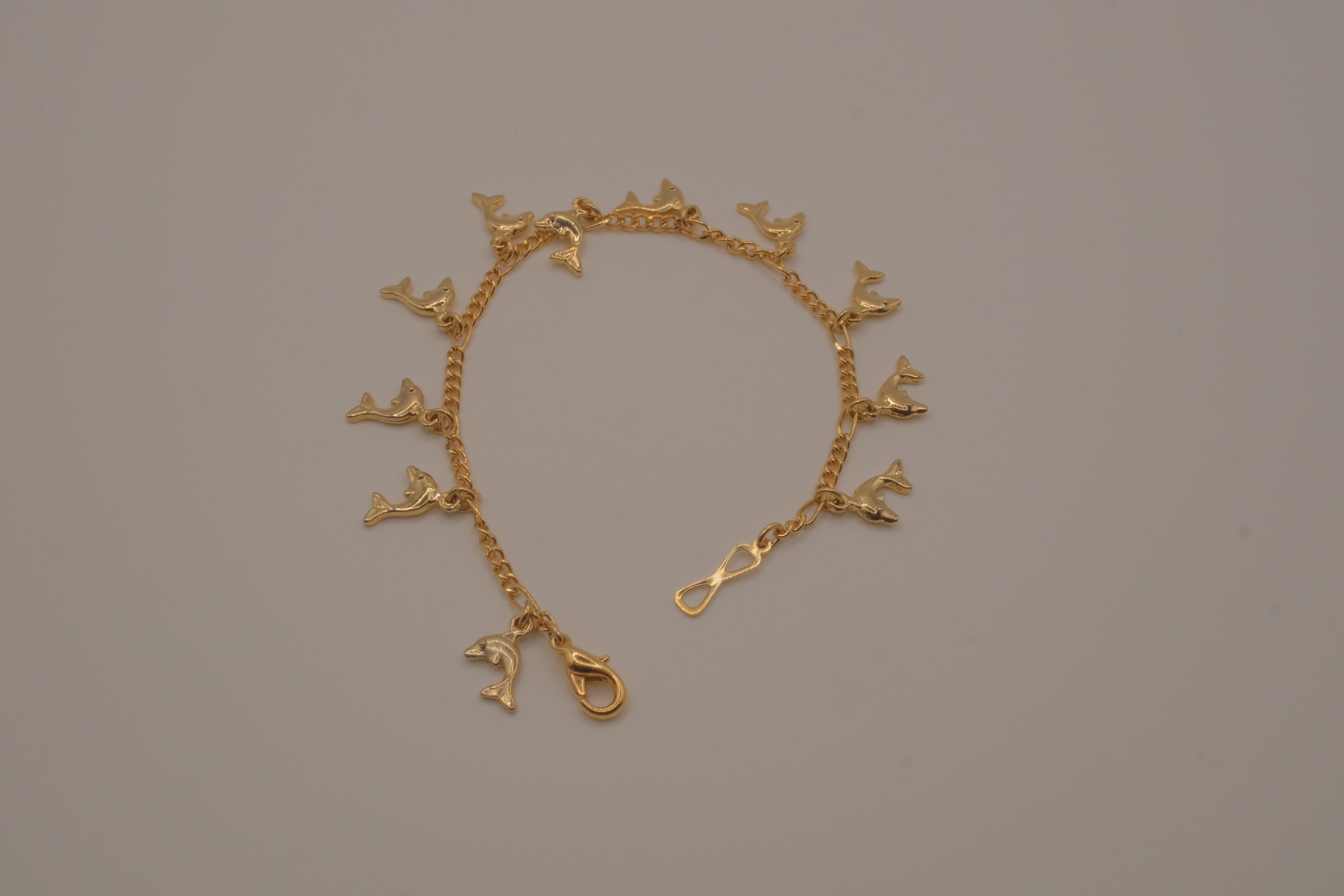 Gold tone Dolphin charm bracelet