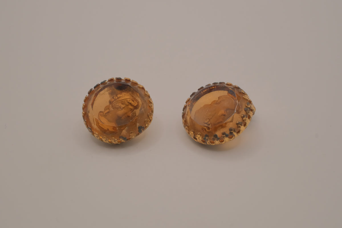 Vintage translucent amber-tone molded glass cameo clip-on earrings