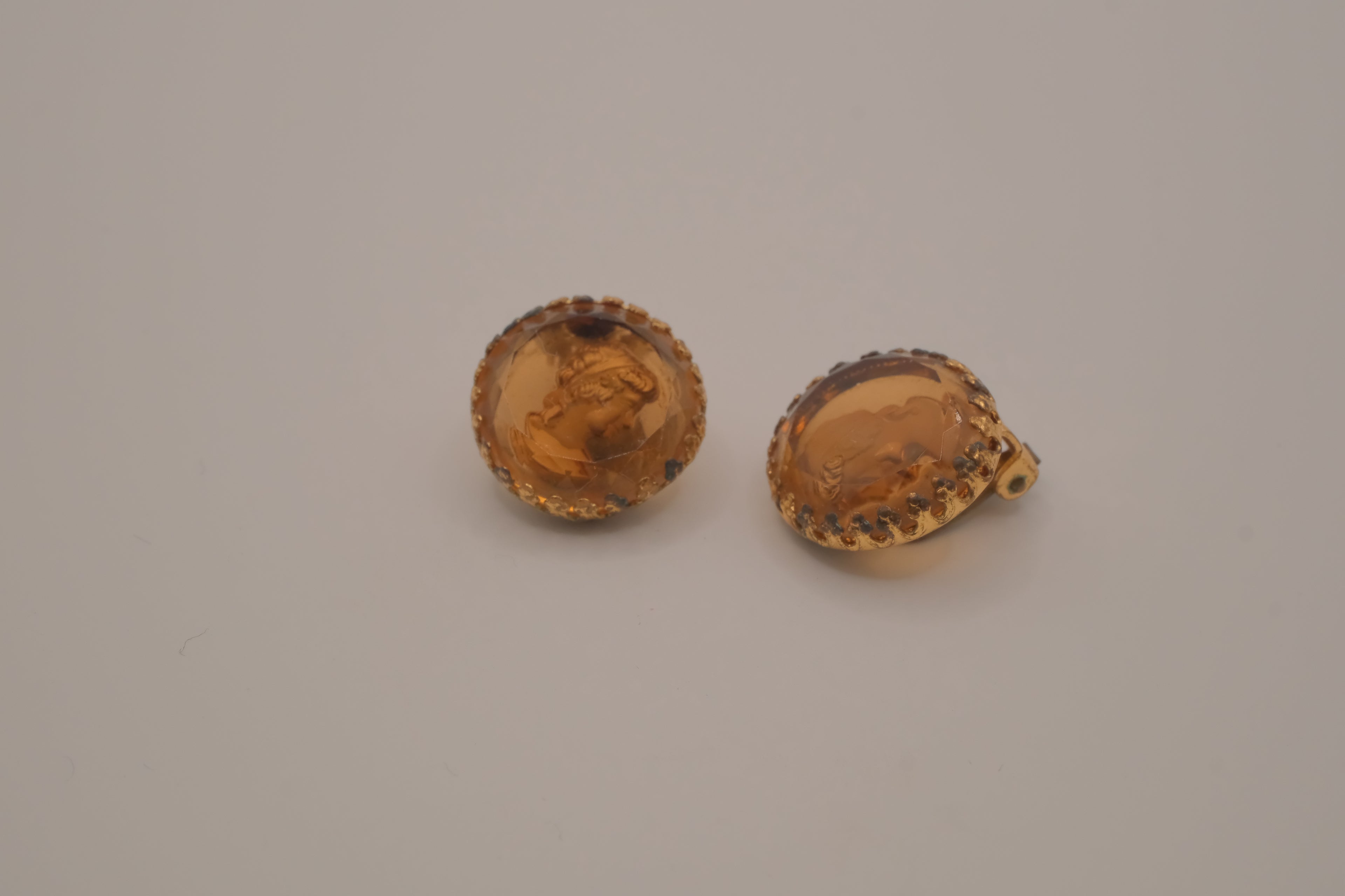 Vintage translucent amber-tone molded glass cameo clip-on earrings