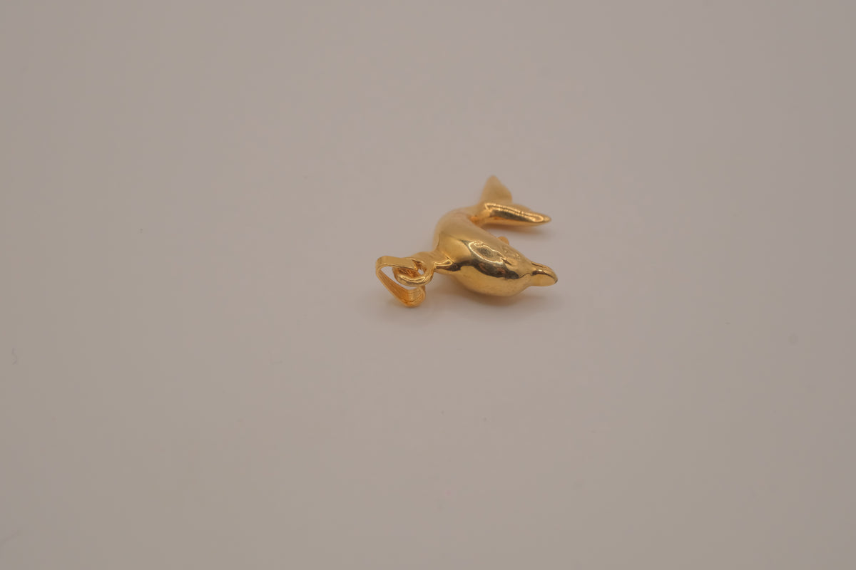 Classic gold toned dolphin pendant