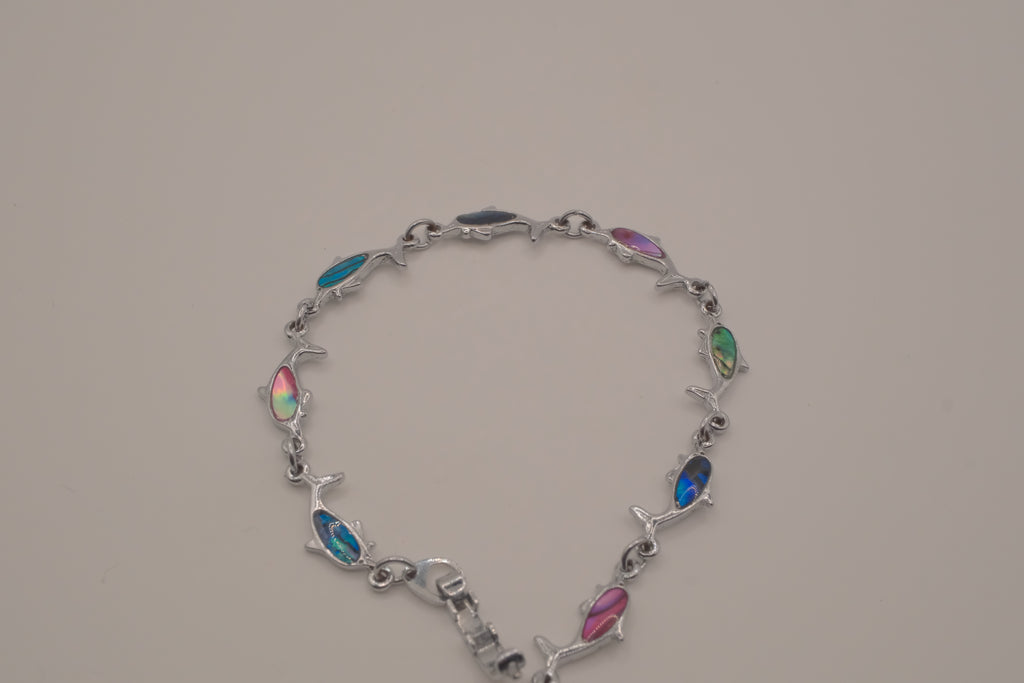 Silver-tone dolphin link bracelet featuring colorful abalone shell inlays