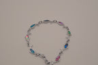 Silver-tone dolphin link bracelet featuring colorful abalone shell inlays
