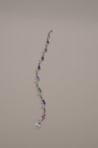 Silver-tone dolphin link bracelet featuring colorful abalone shell inlays