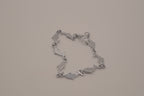 Silver-tone dolphin link bracelet featuring colorful abalone shell inlays