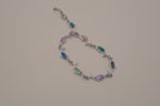 Silver-tone dolphin link bracelet featuring colorful abalone shell inlays