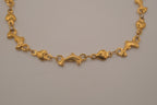 Gold tone Dolphin &amp; Hearts link bracelet