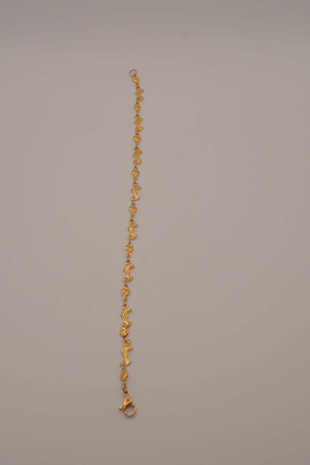 Gold tone Dolphin &amp; Hearts link bracelet