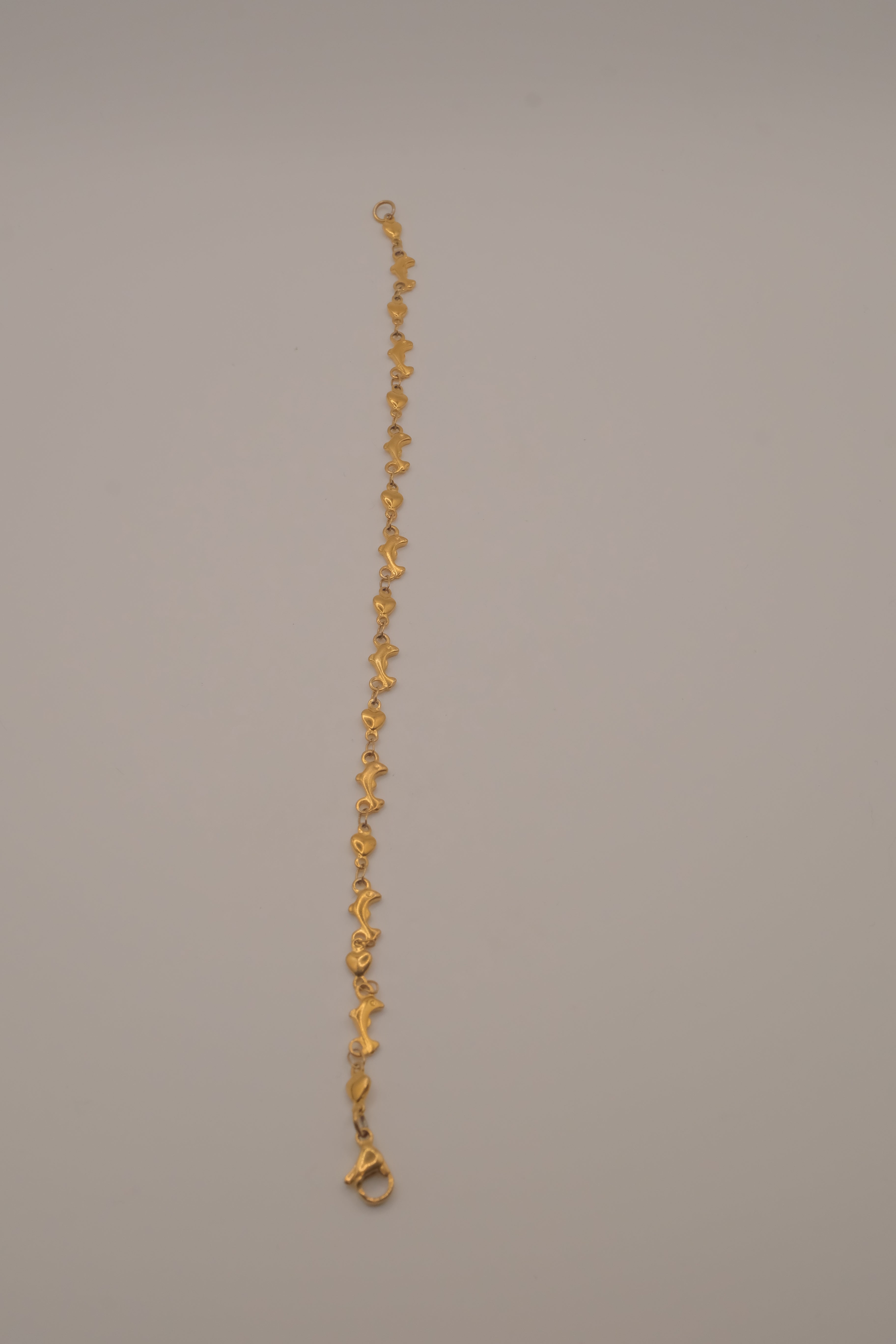 Gold tone Dolphin &amp; Hearts link bracelet