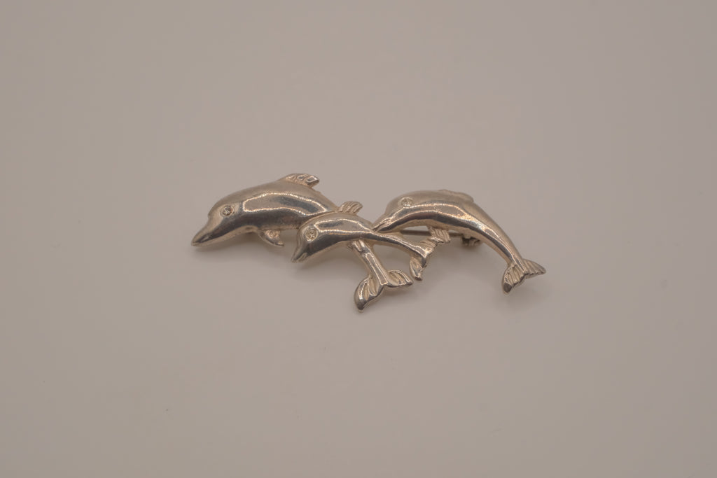 Vintage silver tone three-dolphin brooch