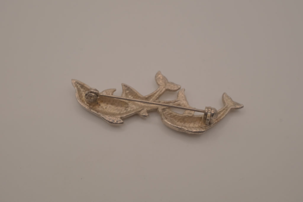 Vintage silver tone three-dolphin brooch