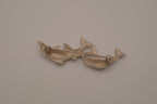 Vintage silver tone three-dolphin brooch