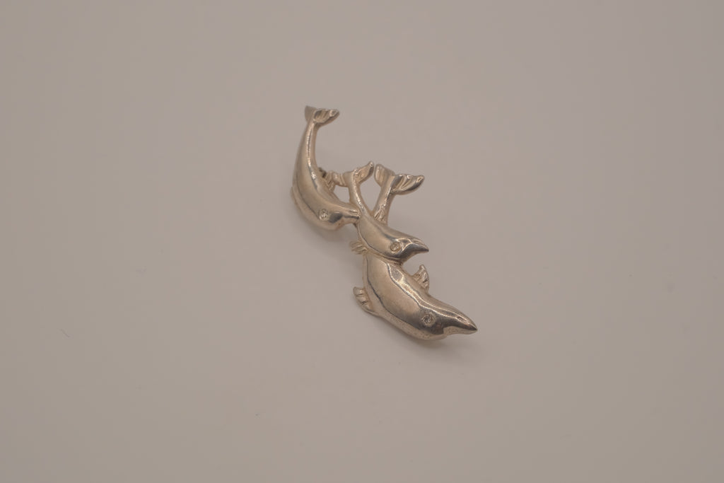 Vintage silver tone three-dolphin brooch