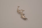 Vintage silver tone three-dolphin brooch