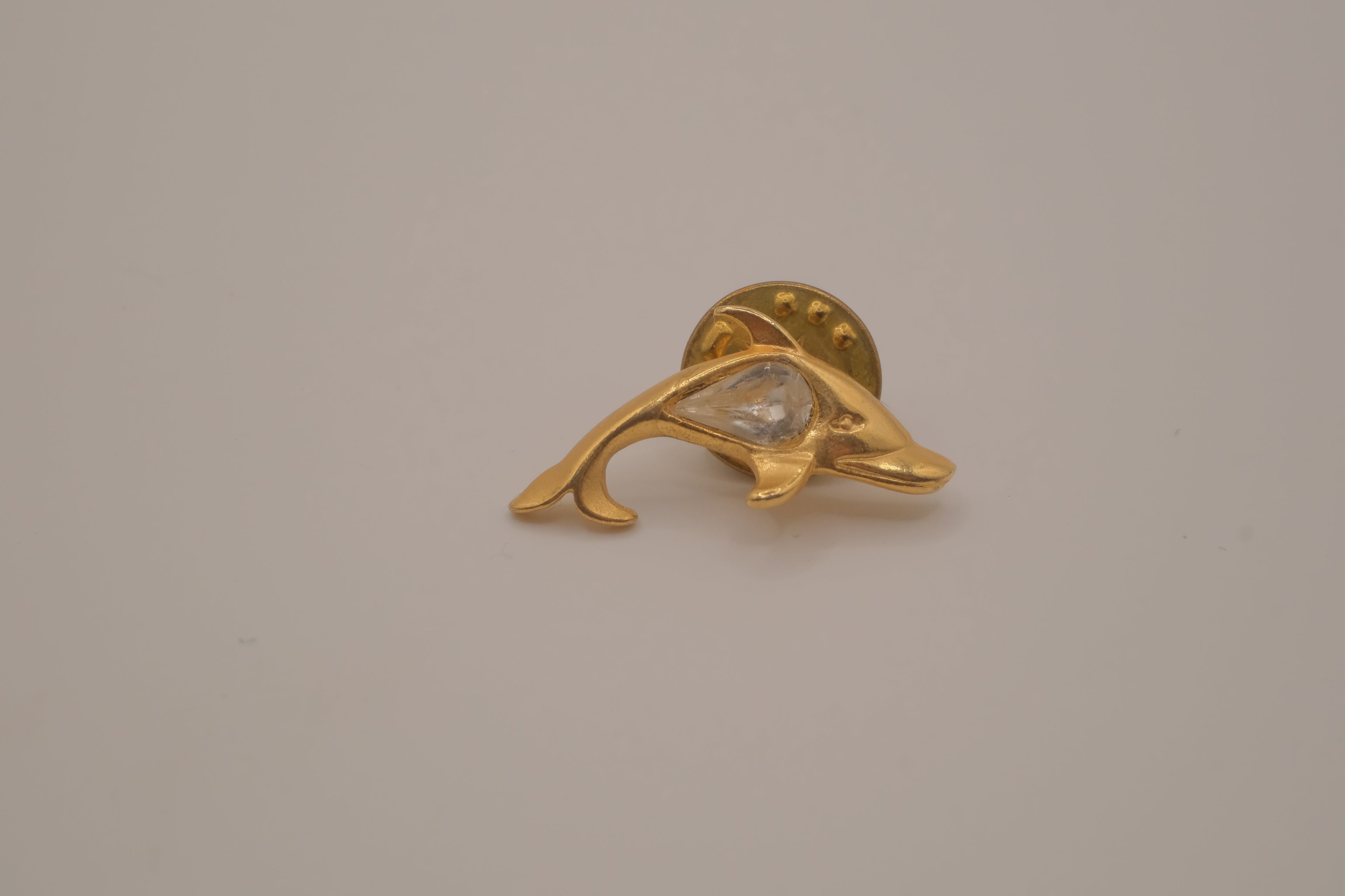 Vintage gold-toned dolphin rhinestone lapel pin