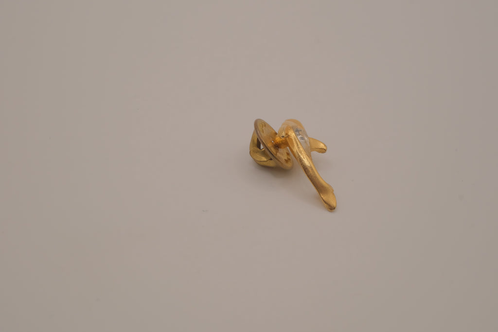Vintage gold-toned dolphin rhinestone lapel pin