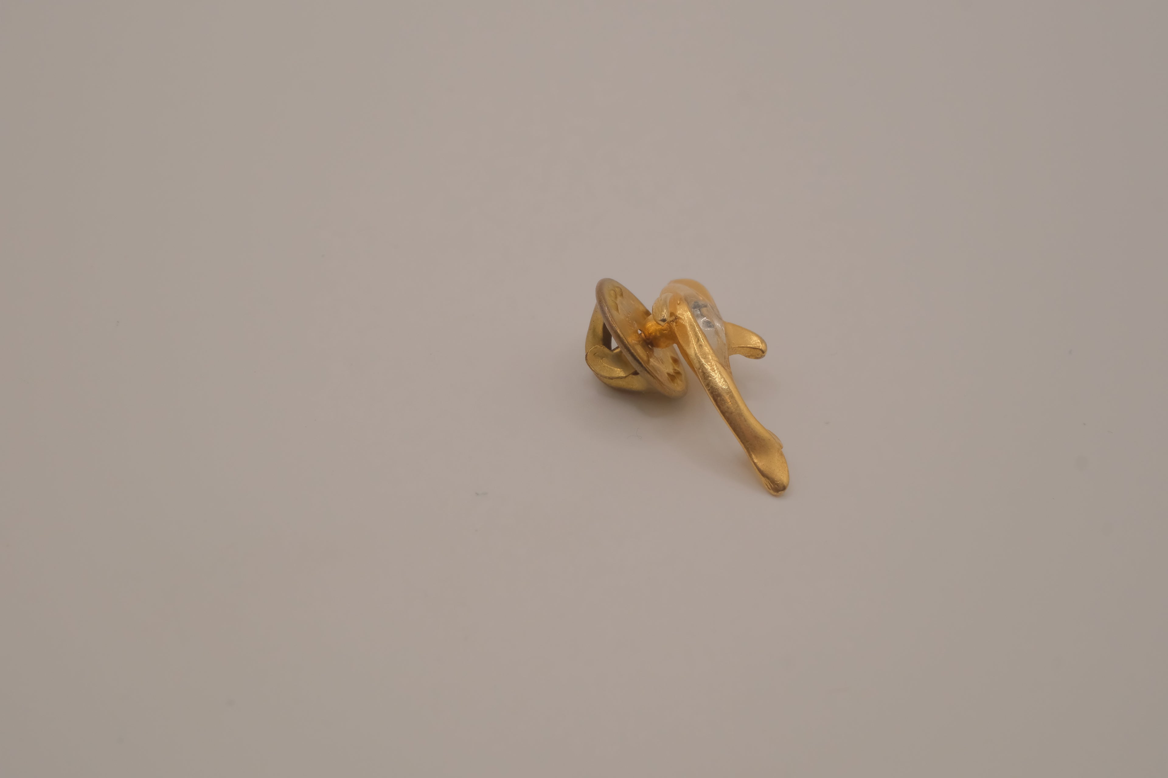 Vintage gold-toned dolphin rhinestone lapel pin
