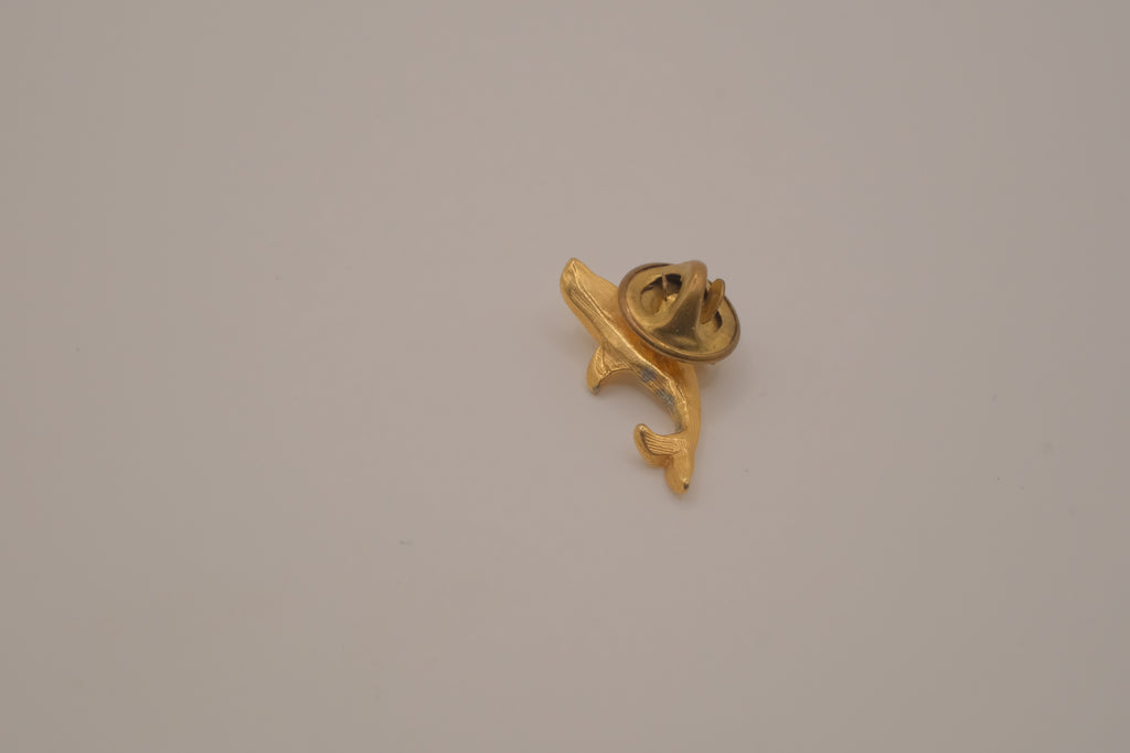Vintage gold-toned dolphin rhinestone lapel pin